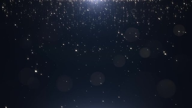 Glamorous golden particles on a black background