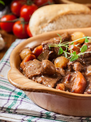 Beef Bourguignon stew served with baguette