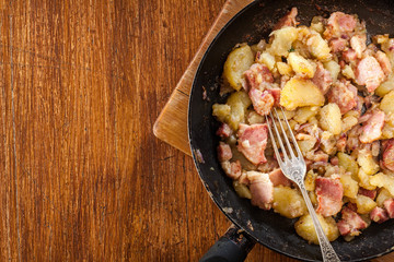 Fried potatoes with onion and bacon