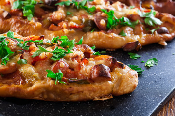 Traditional Turkish pide with meat and vegetables