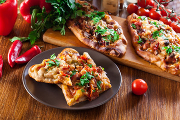 Sliced traditional Turkish pide with meat and vegetables