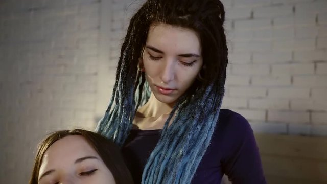 Portrait of sweet lesbian couple indoor.