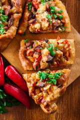 Sliced traditional Turkish pide with meat and vegetables