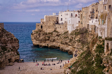 The stunning beach of Polignano a Mare on the Italian coast of Puglia, a small charming village built on top of the sea