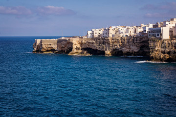 Fototapeta na wymiar The scenic village of Polignano a Mare in Puglia Italy, with its beautiful houses above the sea