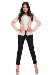 Fototapeta premium relaxed beautiful business woman with hands on waist