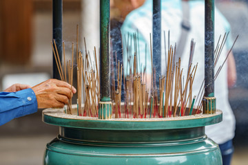 People light incense sticks for praying in Japan