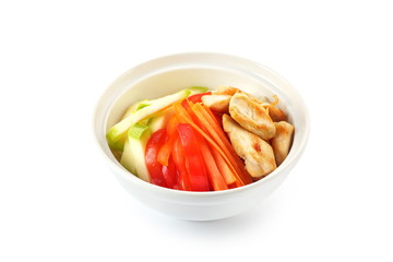 Grilled chicken fillets and vegetables on a white background isolated