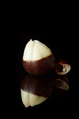 snake fruit on a black background. beautiful edible exotic fruits. food for vegans