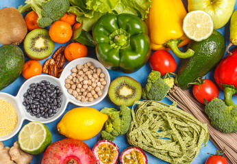 Healthy vegan food concept. Fruits vegetables background. Vegetable products, pasta, cereals and beans for a vegetarian diet, top view.