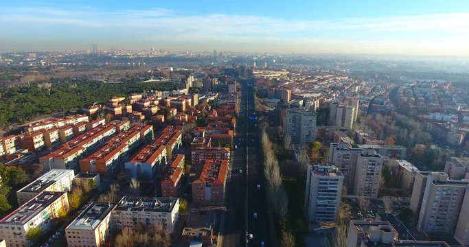 Aerial shot of Madrid city highway and residential areas at early morning.
