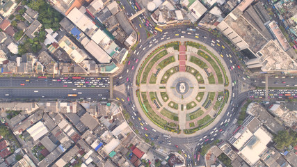 Top view city , Aerial view road , Expressway with car lots in the city in Thailand. Beautiful Street at downtown.Road roundabout