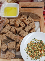 Bread. Pieces of healthy rye bread and spices for melting