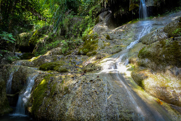 Waterfall hidden in the tropical jungle (erawan waterfall) in kanchanaburi province asia southeast asia Thailand