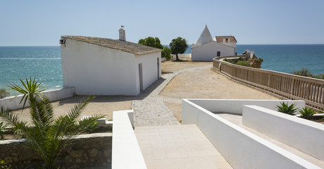 View of the white chapel and the ocean in portuguese city