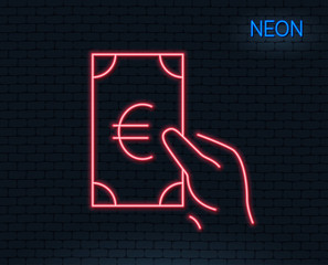 Neon light. Hold Cash money line icon. Banking currency sign. Euro or EUR symbol. Glowing graphic design. Brick wall. Vector