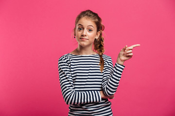 Cute teenage girl standing isolated