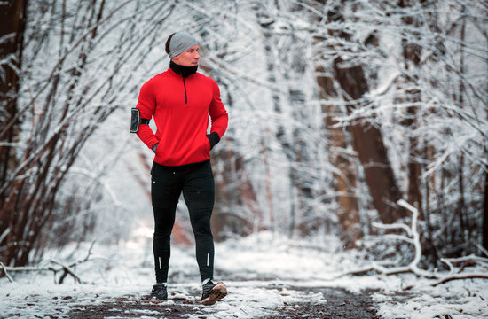 Winter Running Training, Runner At Cold Snow Weather