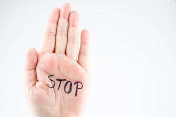Hand of a woman with the word stop