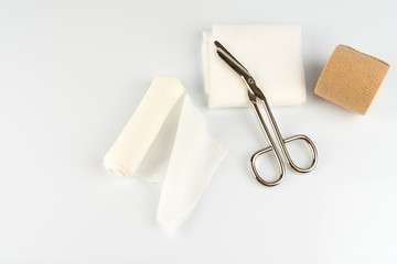 medical tape with scissors, white background