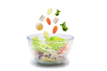 Healthy Vegetable Salad in Transparent Cup contains tomato, rice, potato, green vegetables on a white background.isolated on white 