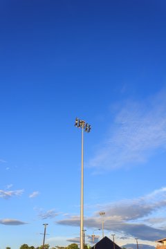 Pillar spotlights with blue sky.