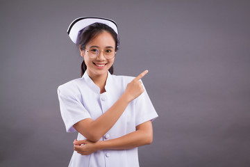 asian nurse pointing showing something