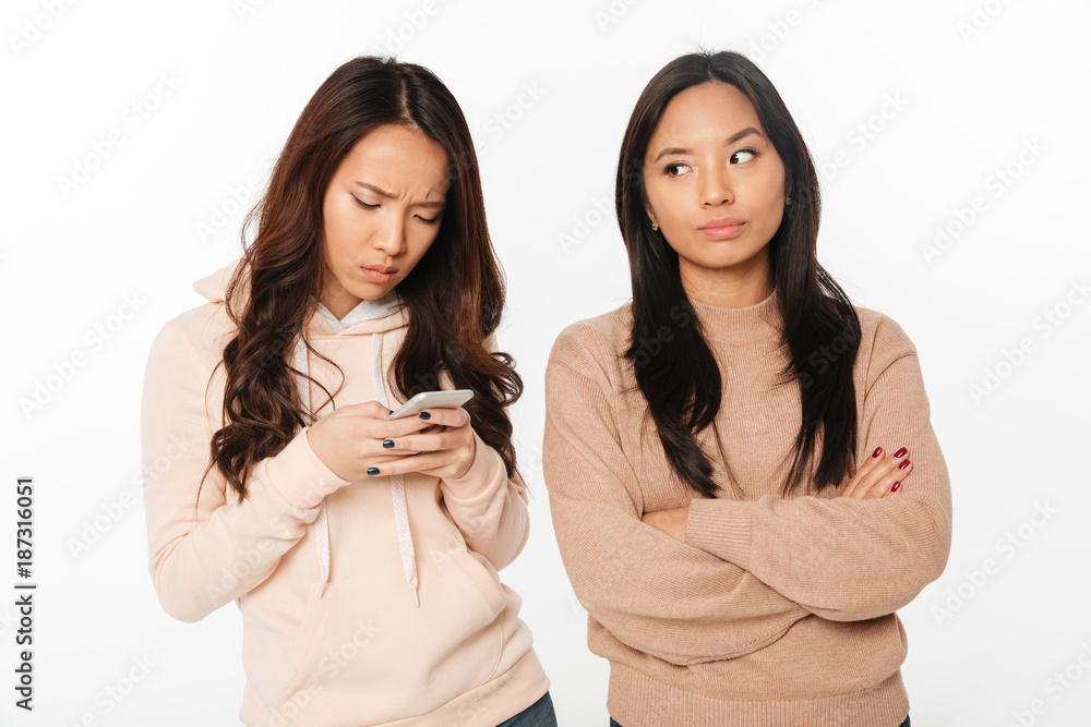 Poster asian girl displeased because of her sister