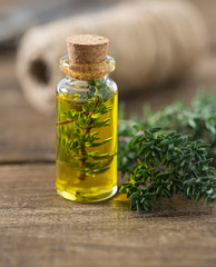 thyme oil on wooden surface