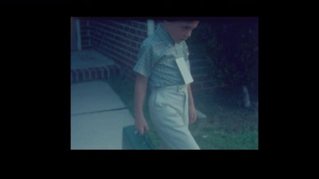 1965 Dog chases cute little Boy with lunch box leaving for first day school