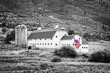 Typical vintage american barn with american flag, Park City, Utah - Black and white photography,...