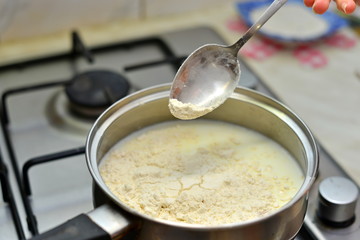 bechamel sauce in a pan and ingredients