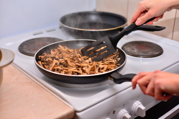 Fresh mushrooms collected in the forest fried in a deep frying pan,mushroom protein source,space for text