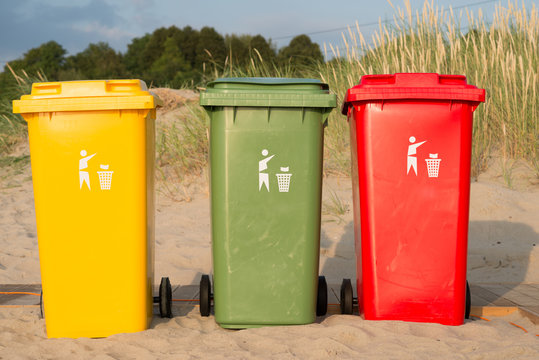 
Waste sorting containers are on the beach
