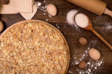 Homemade cake with cream on a wooden surface