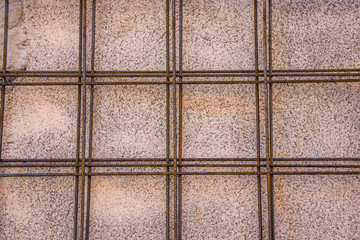 Texture of a wall with construction irons