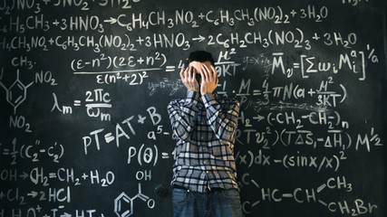 scientist man disappointed about problems experiment in chemical and mathematical equations room