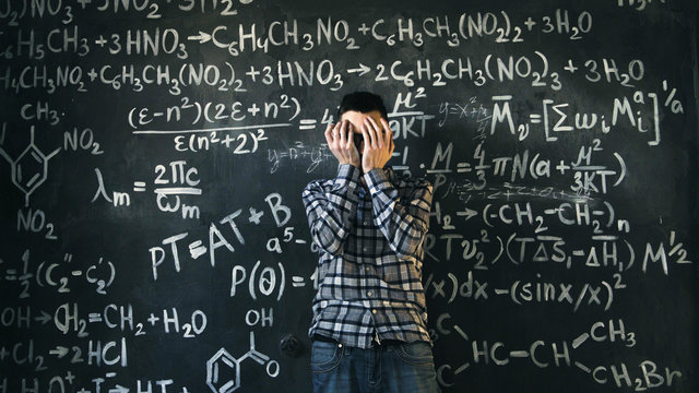 scientist man disappointed about problems experiment in chemical and mathematical equations room