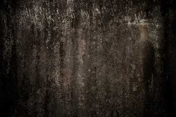 Old concrete wall with black stain.