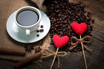 Red glitter hearts on coffee beans