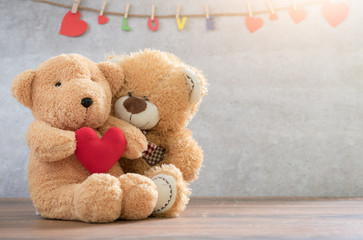two teddy Bear with Heart on marble background