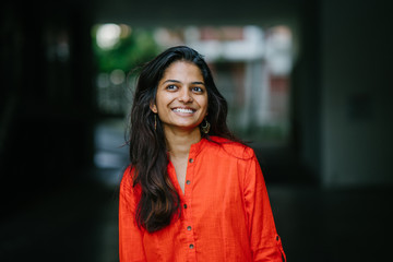 Cheerful and smiling young Indian lady