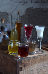 Selection of alcoholic drinks. Set of wine, brandy, liqueur, tincture, cognac, whiskey in glasses, bottles. Large variety of alcohol and spirits for making cocktails and drink. Copy space for text.