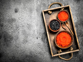 Old tray with black and red caviar.