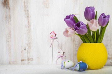 Bouquet purple tulips and Easter eggs