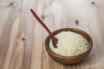 Raw long-grain steamed rice in a bowl