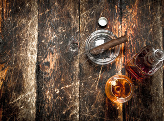 French cognac with a smoking cigar.