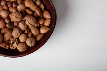 Walnuts isolated on white wood background 