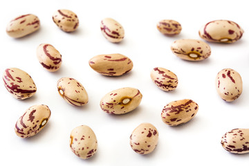 Raw pinto beans isolated on white background

