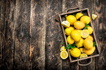 Fresh lemons on an old tray.